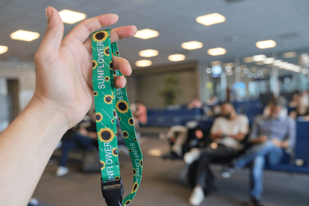 Sunflower lanyard shown at an airport